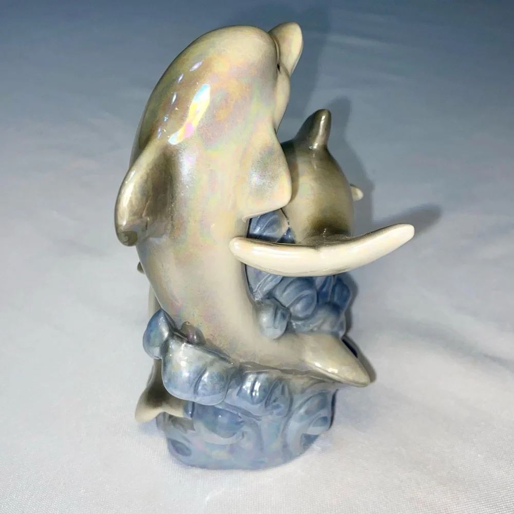 Glazed Ceramic Dolphin Trio on a blue Wave